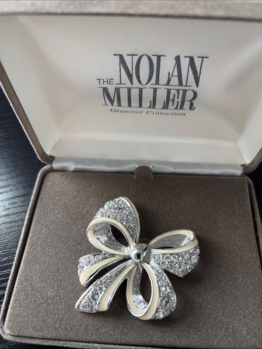 Nolan Miller Silver Bow Brooch with White Enamel and Clear Crystals